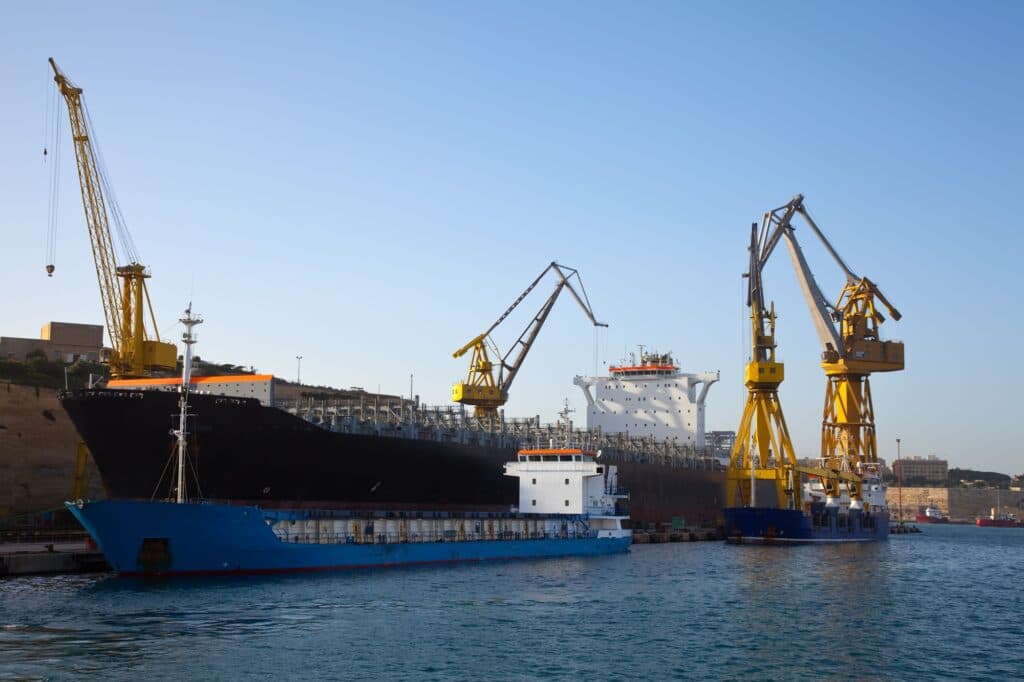 Cargo ship in dry dock at a global manufacturing port