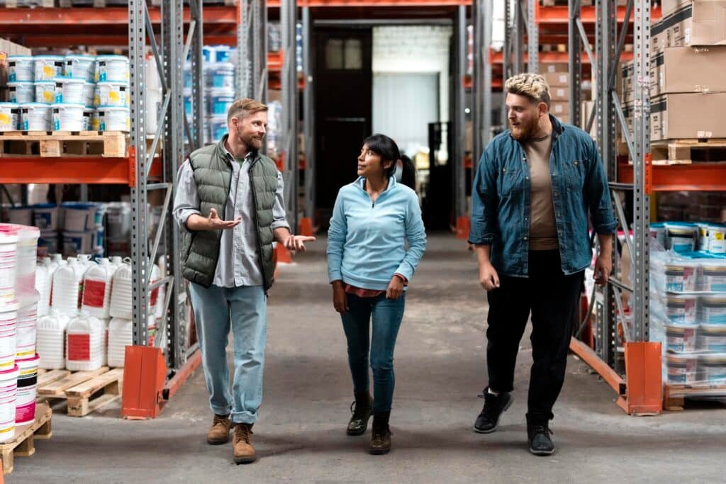 Supply chain management professional conducting a factory tour